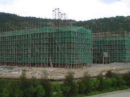 Lashed bamboo scaffolding, new construction project (what's a safety harness?)