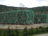 Lashed bamboo scaffolding, new construction project (what's a safety harness?)